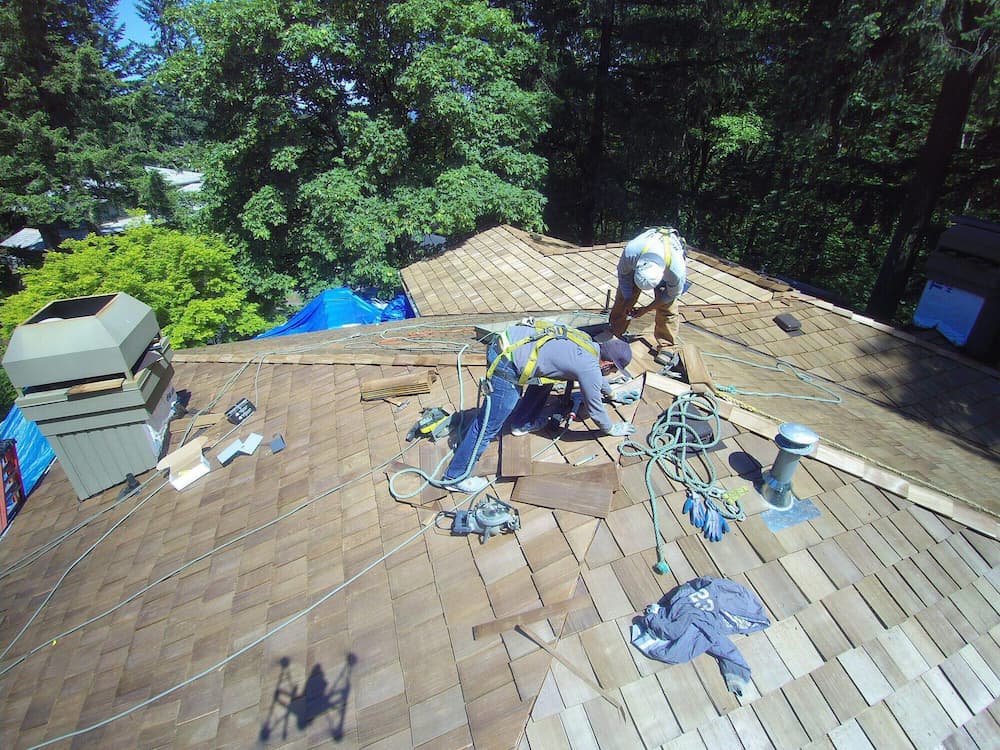 Roofer working to replace a roof in Portland, OR