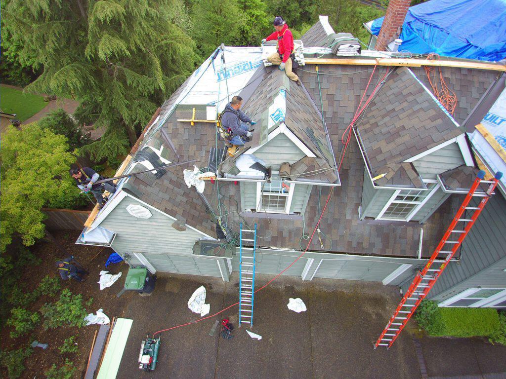 roofing crew wearing safety anchors