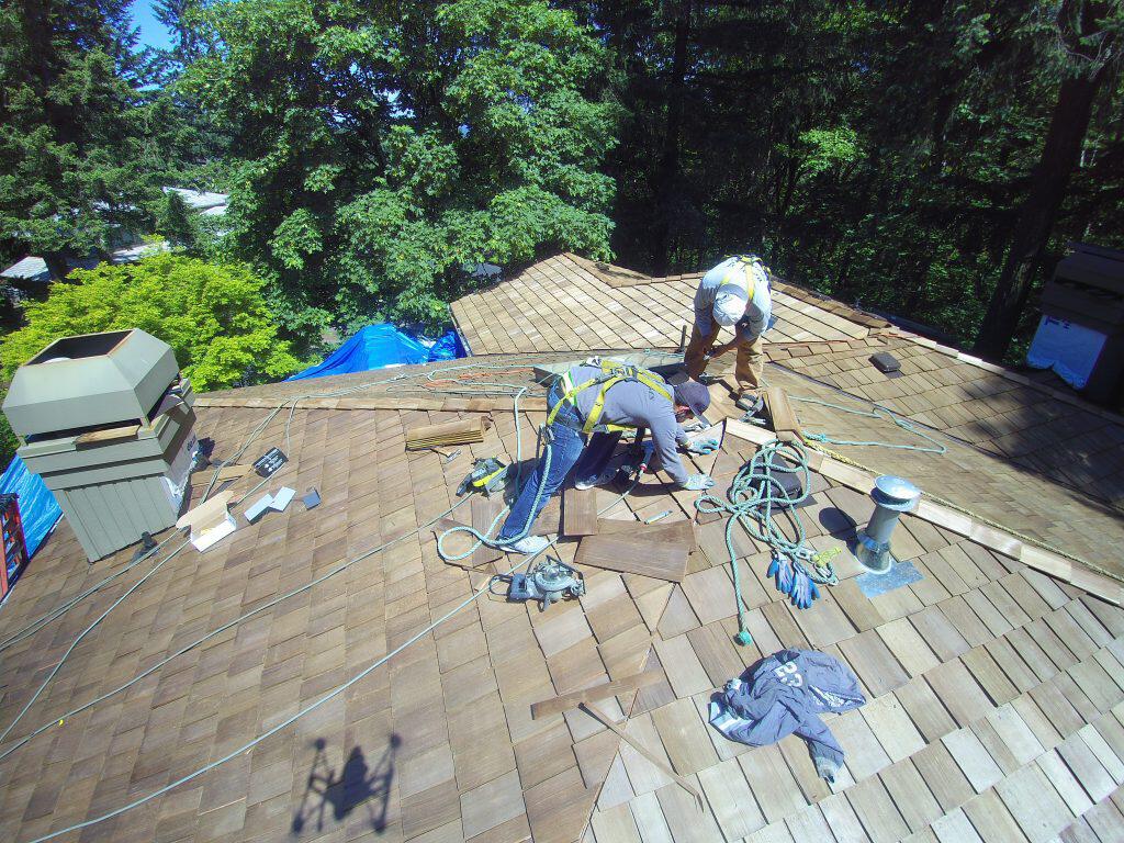 portland roofers working on roof